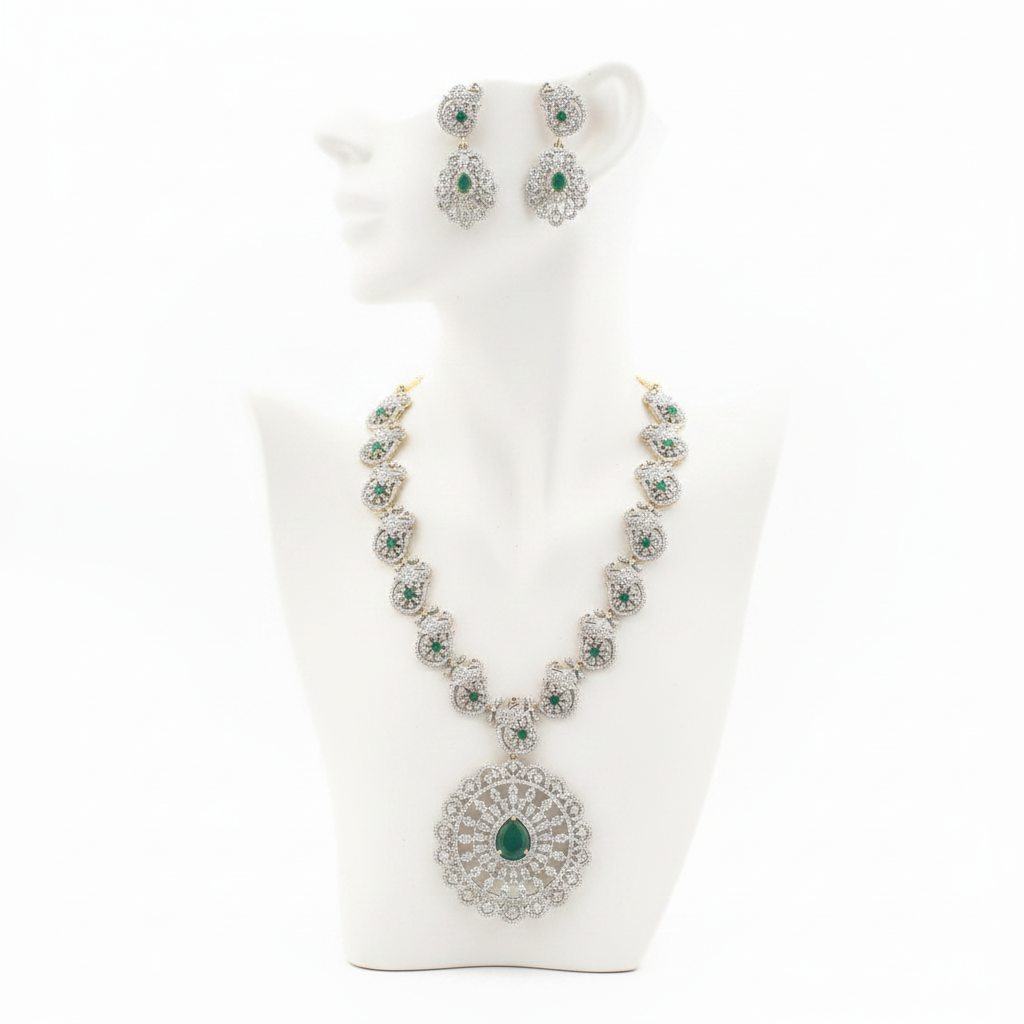 Emerald and diamond peacock necklace set displayed on mannequin