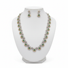 Emerald CZ necklace draped on mannequin showing 25-inch length