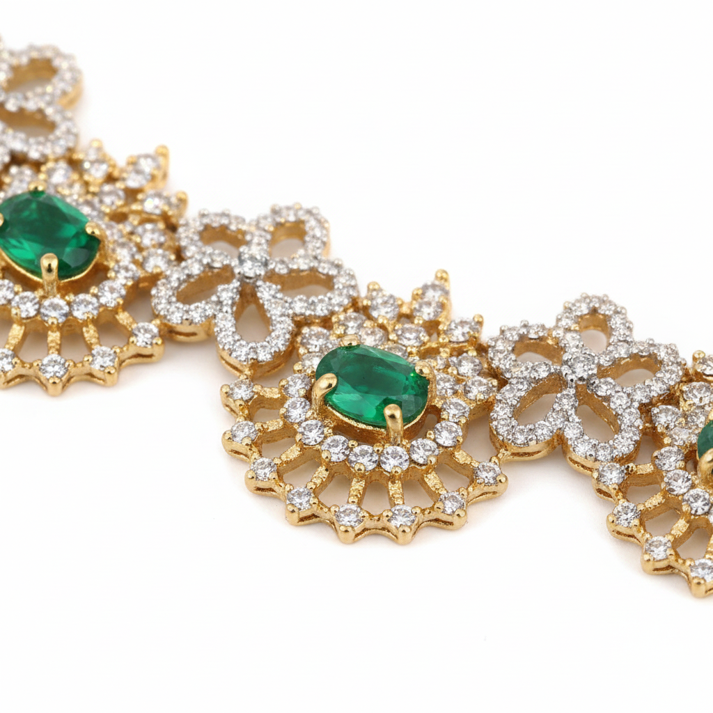 Close-up detail of emerald CZ necklace floral sunburst motifs