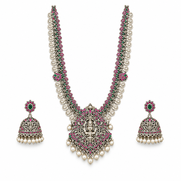 Oxidized Lakshmi long haram necklace with matching jhumka earrings on a white background