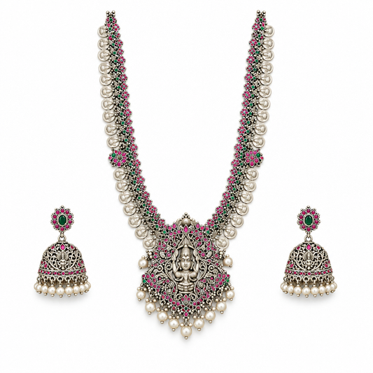 Oxidized Lakshmi long haram necklace with matching jhumka earrings on a white background