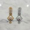 CZ Open Fan Chandelier Earrings - Both Finishes Flat Lay Marble