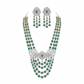 Emerald green and diamond multi-layer bridal necklace set with matching earrings on white background
