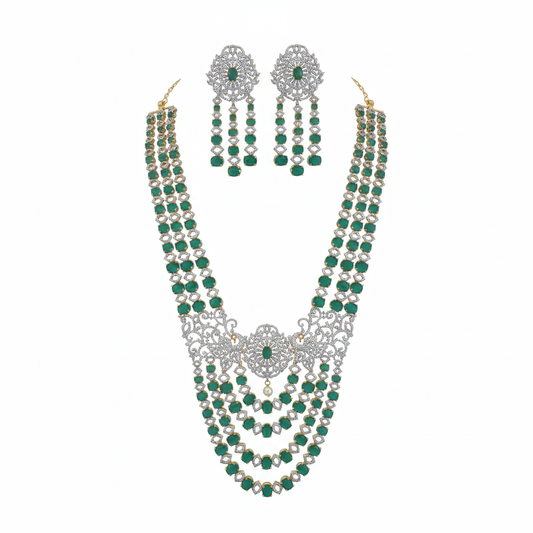 Emerald green and diamond multi-layer bridal necklace set with matching earrings on white background