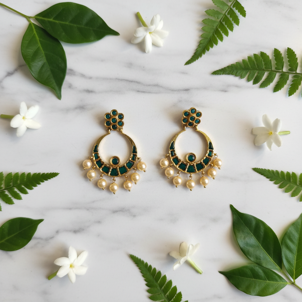 Emerald Chandbali Earrings – flat lay on marble