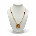Narasimha temple pearl necklace displayed on mannequin