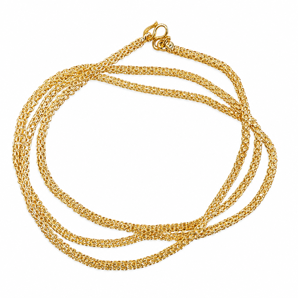 Gold-plated fine link chain on a white background