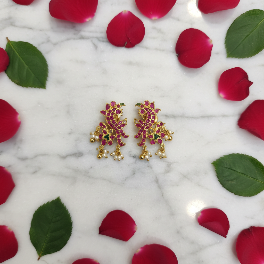 Kempu Peacock Studs – flat lay on marble
