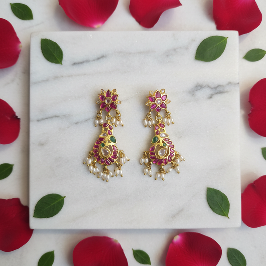 Kempu Peacock Dangler Earrings – flat lay on marble
