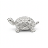 Silver turtle idol, side view on white background