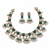 Victorian Kundan necklace set with emerald green gemstones on white background