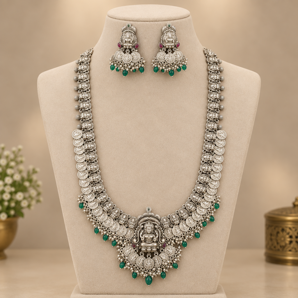 Oxidized Lakshmi long haram necklace and matching jhumka earrings on a mannequin