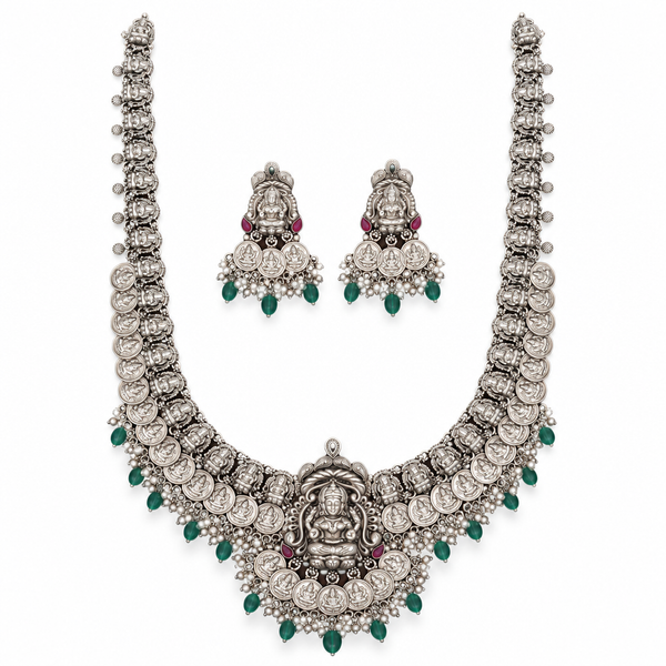 Oxidized Lakshmi long haram necklace with matching jhumka earrings on a white background
