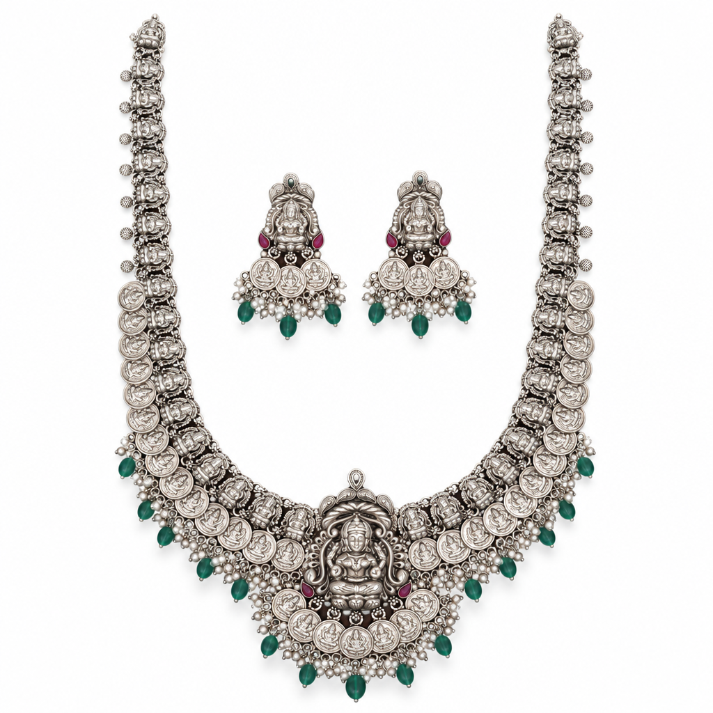 Oxidized Lakshmi long haram necklace with matching jhumka earrings on a white background