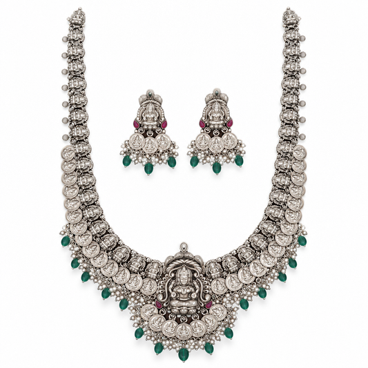 Oxidized Lakshmi long haram necklace with matching jhumka earrings on a white background
