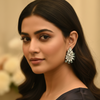 Model wearing silver plated CZ earrings - Aqua Blue variant