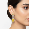 Model wearing CZ teardrop flower drop earrings in yellow