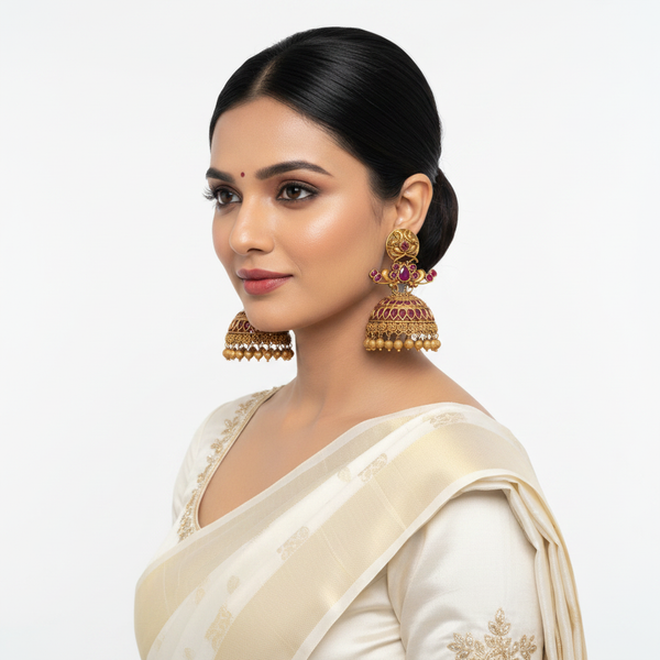 Model wearing Premium Ruby Peacock Matte Gold Jhumka Earrings on white background - lifestyle photo