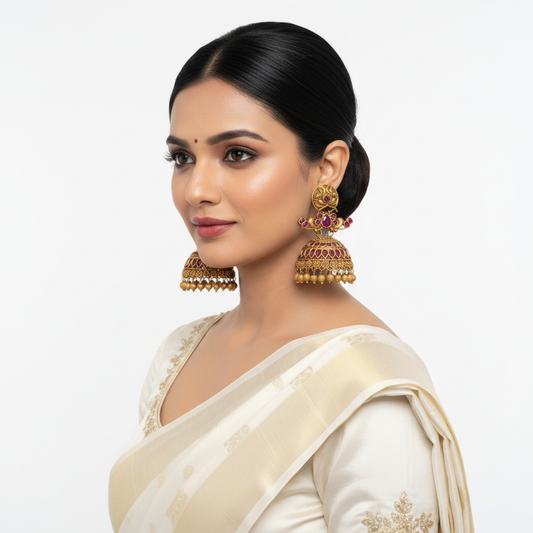 Model wearing Premium Ruby Peacock Matte Gold Jhumka Earrings on white background - lifestyle photo