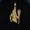 Close-up macro of Lord Shiva gold pendant showing trishul and intricate carving detail