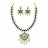 Emerald green CZ necklace set flat lay white background