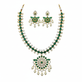 Emerald green CZ necklace set flat lay white background