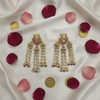 Polki Kundan Pearl Tassel Earrings - Flat Lay on Ivory Silk