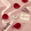 Silver Heart Locket Pendant – romantic flat lay with rose petals