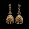 Close-up macro detail of CZ long jhumka earring with green marquise stones and crystal drops
