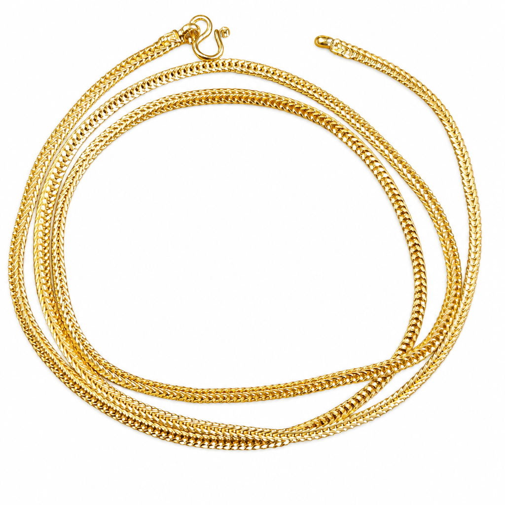 Gold-plated woven link chain on a white background