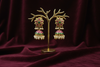 Star Flower Emerald Kundan Jhumka - Boutique Display on Burgundy Velvet