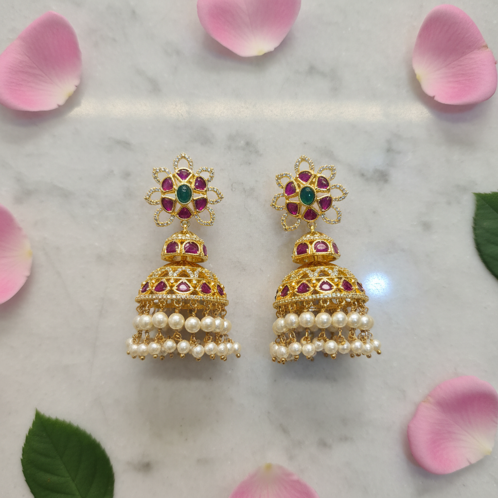 Kempu Emerald Jhumka Earrings flat lay on marble with rose petals