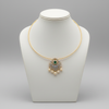 Gold hasli choker necklace displayed on mannequin bust