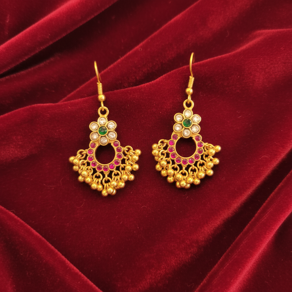 Jadau Kundan Flower Chandbali Dangler Earrings on red velvet flat lay