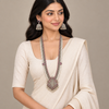 Model wearing an oxidized Lakshmi long haram necklace and matching jhumka earrings