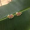 Handmade Kempu Fish Earrings on banana leaf flat lay