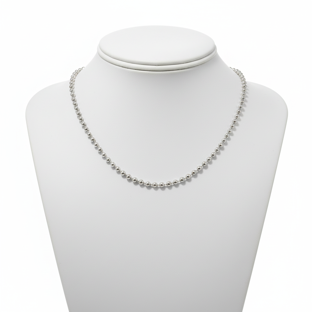 Silver ball chain necklace displayed on mannequin
