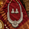 Oxidized Lakshmi long haram necklace and matching jhumka earrings in a cultural Indian flat lay