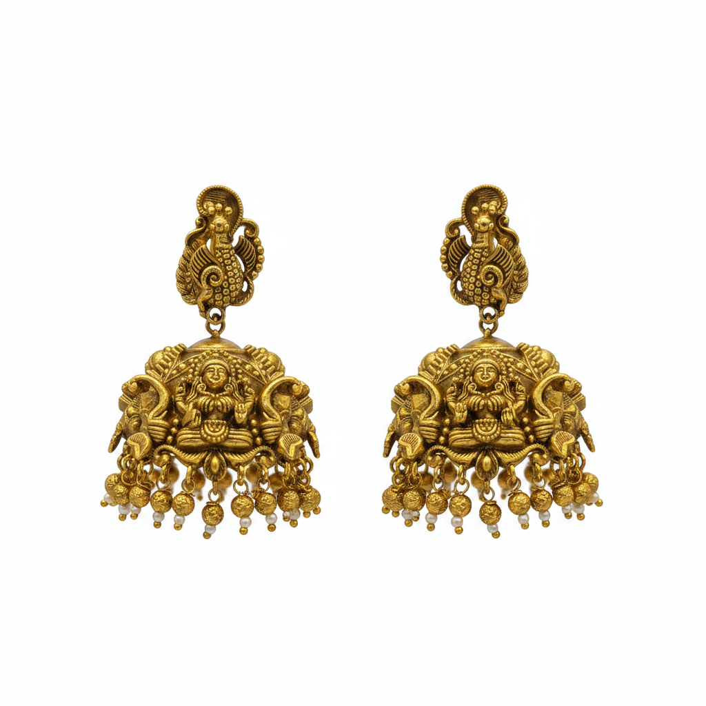 Flat lay of antique Lakshmi temple jhumka earrings on white background