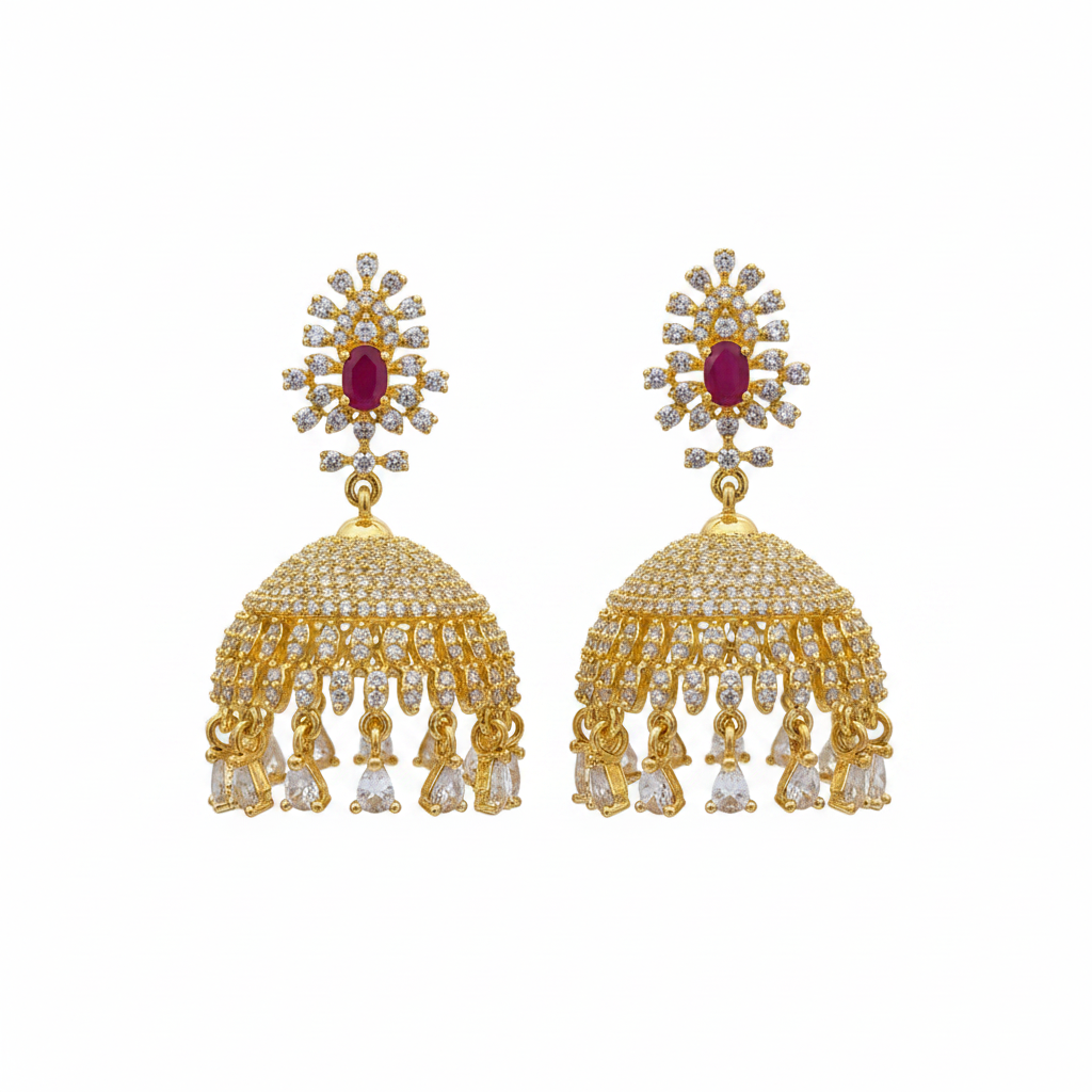 Gold plated CZ jhumka earrings with ruby pink centre stone on white background