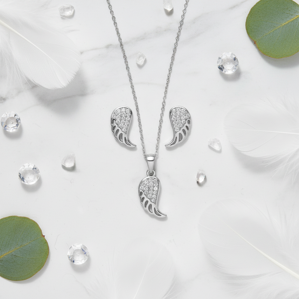 925 Silver Angel Wing Pendant Set – elegant flat lay with feathers and crystals