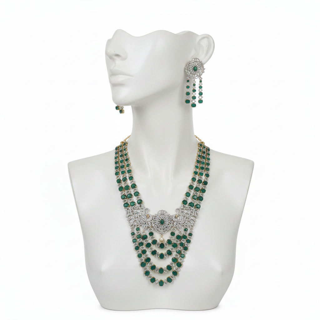 Emerald green and diamond bridal necklace set displayed on mannequin