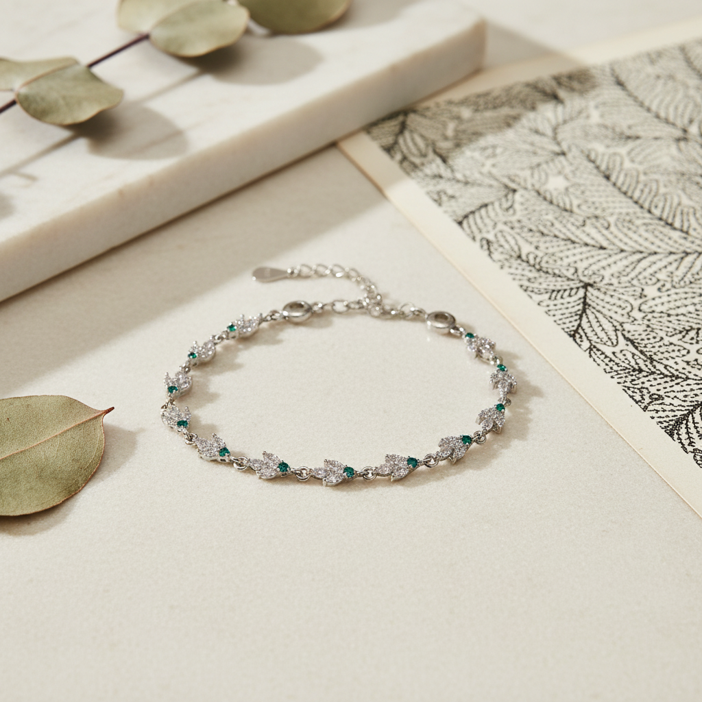 Lifestyle image of delicate sterling silver leaf bracelet