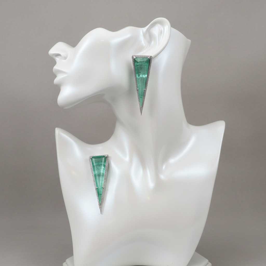 Mannequin display of pastel green zircon earrings
