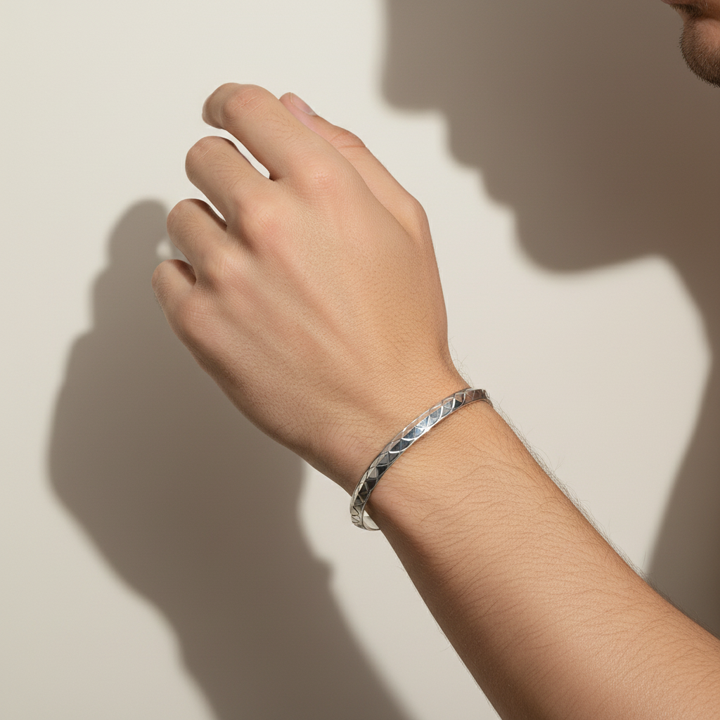 Man's hand wearing Punjabi Silver Kada