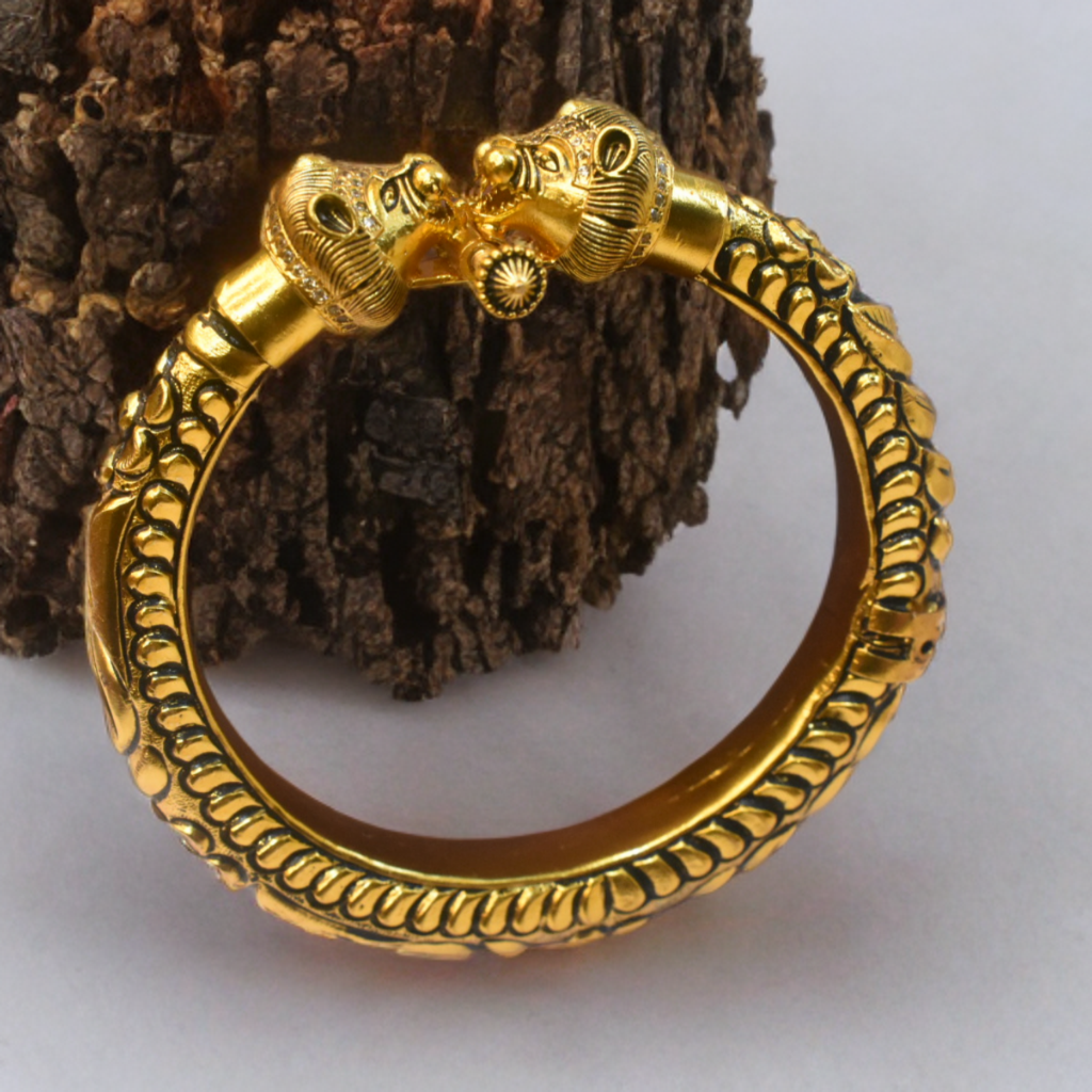 mens kada with lion head design on a wooden background