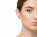 Model flaunting earrings