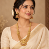 Model wearing antique Lakshmi long haram with matching jhumka earrings