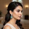 Model wearing aqua blue CZ dangle earrings
