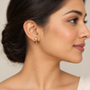 Model wearing blue pearl flower earrings